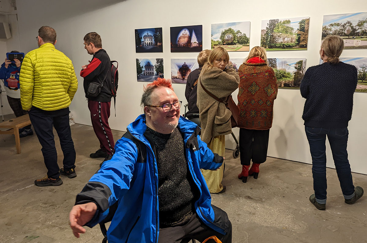 A member of 'Shadowlight Artists' at a gallery exhibition